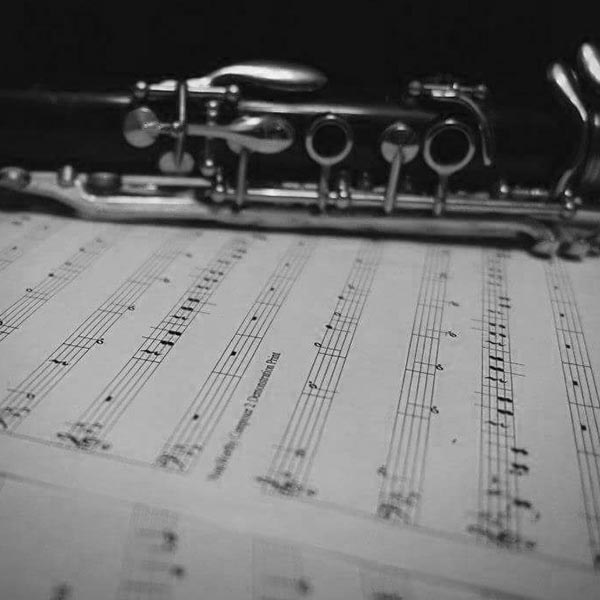 clarinet resting on sheet music