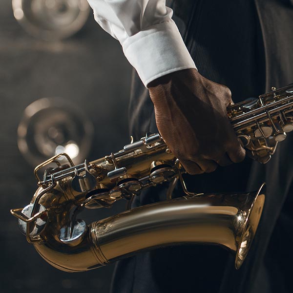 man holding saxophone