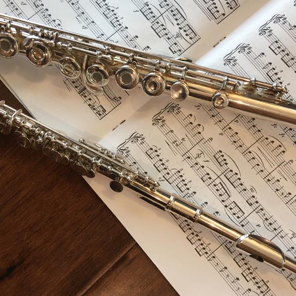 two flutes on sheet music